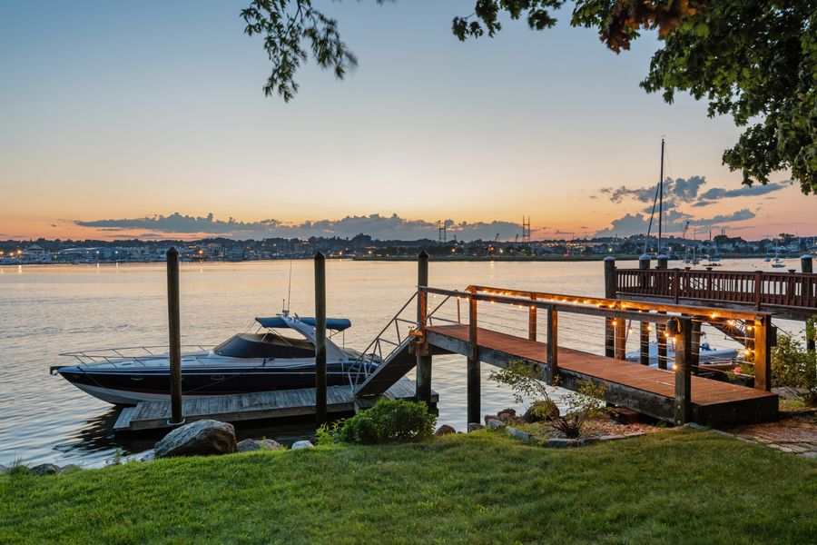 Private dock at dusk with boat moored